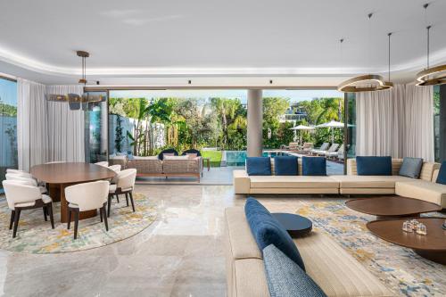 a living room with a couch and a table at Bayou Villas Antalya - Ultra All Inclusive in Antalya