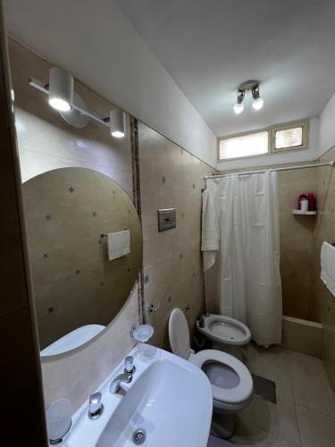 a bathroom with a sink and a toilet at La mejor ubicación y todo nuevo in Mendoza