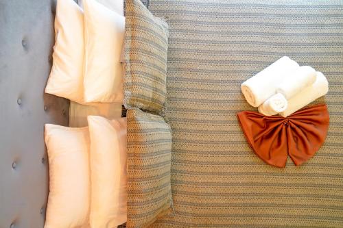 a close up of a couch with pillows and towels at Sufra Suite in Istanbul