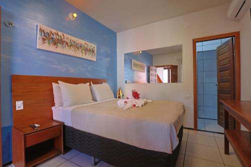 Postel nebo postele na pokoji v ubytování Beach house Suites