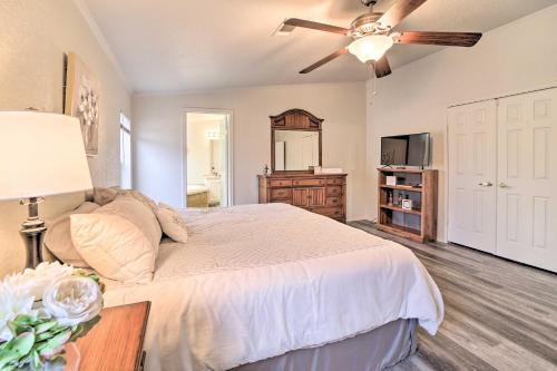 a bedroom with a bed and a ceiling fan at Eufaula Escape with Deck - Steps to Lake! in Eufaula