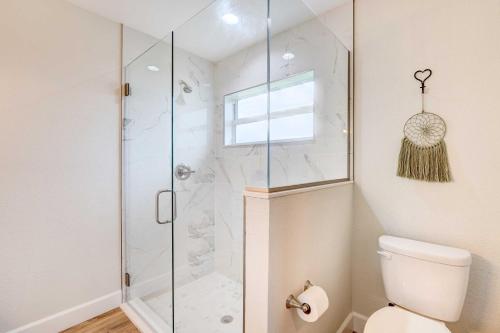 a bathroom with a shower with a toilet at Golf and Pool Access Pet-Friendly Sebring Home! in Sebring