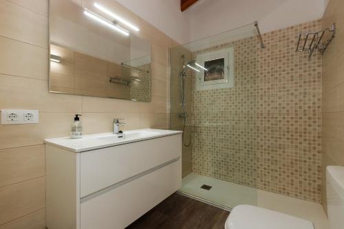 a bathroom with a sink and a shower at Casa Sol del Sur 4 in Son Xoriguer