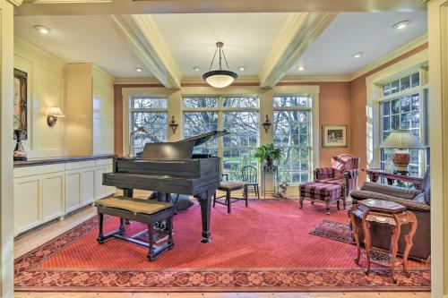 a living room with a piano in a room at Spacious Hillsboro Home about 18 Mi to Portland! in Hillsboro