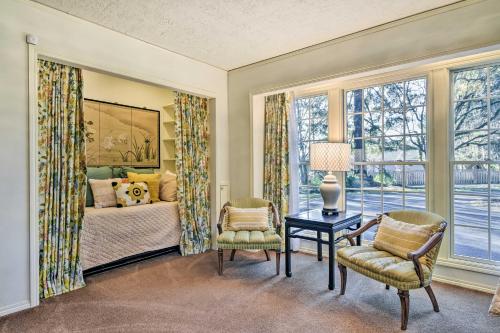 a bedroom with a bed and a table and chairs at Spacious Hillsboro Home about 18 Mi to Portland! in Hillsboro