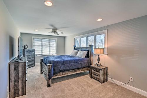 a bedroom with a bed and a television in it at Villa with Pool and Acreage about 10 Mi to Franklin 