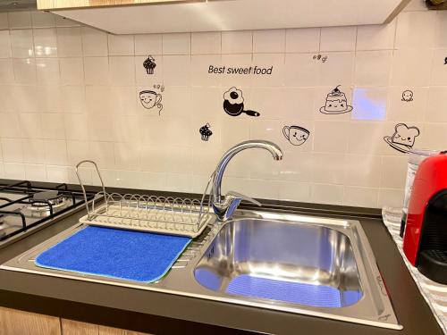 A kitchen or kitchenette at Suite Gaia