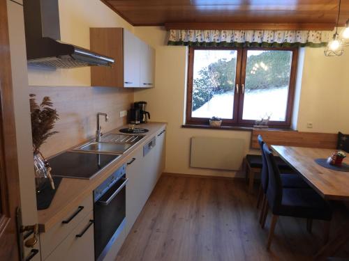 a kitchen with a sink and a counter top at Holiday Home Haus Sigfried by Interhome in Bischofshofen