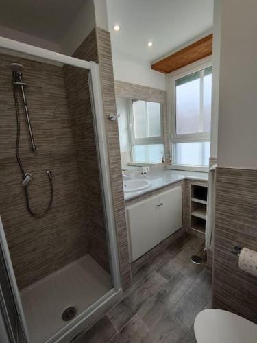 a bathroom with a shower and a sink at [WHITE & WOOD house in Rome] in Rome