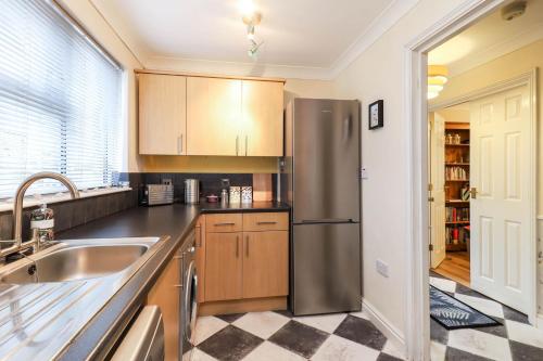 a kitchen with a stainless steel refrigerator at Hope House in East Cowes