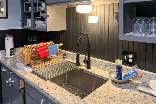 a kitchen counter with a sink in a kitchen at Montrose Escape with Yard Walk to Downtown and Park! in Montrose