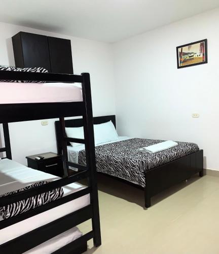 Postel nebo postele na pokoji v ubytování Hostal Viña del Mar