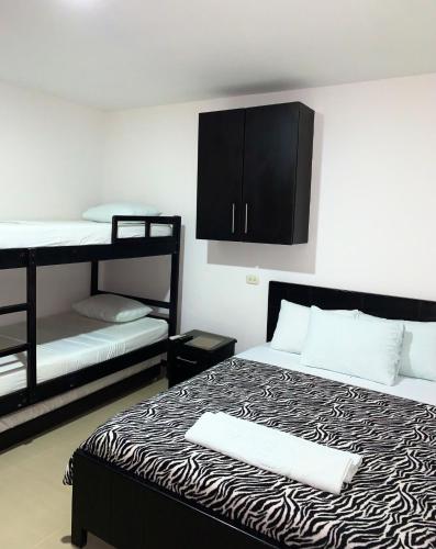 Postel nebo postele na pokoji v ubytování Hostal Viña del Mar