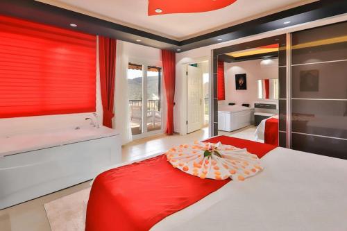 a bedroom with a bed with an umbrella on it at Villa Çalıkuşu Kalkan in Kaş
