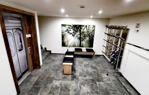 a room with two benches and a painting on the wall at Haus Dirol in Kirchberg in Tirol