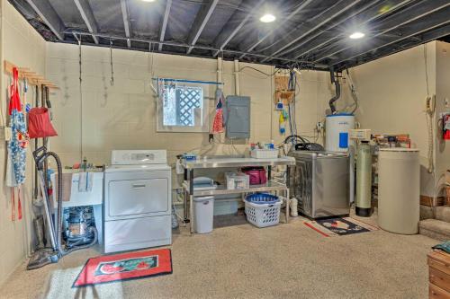a laundry room with a lot of appliances in it at Charming and Secluded Riverside Cabin and 3 Decks in North Vernon