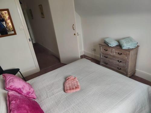 a bedroom with a bed and a dresser at Bexhill Sea View Flat 3 in Bexhill