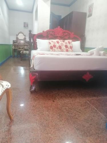 a bedroom with a large bed in a room at Sang Yoo Mountain View Tagaytay Bed and Breakfast - Taal Lake View in Tagaytay