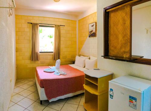Cama o camas de una habitación en Aldeia Tropical