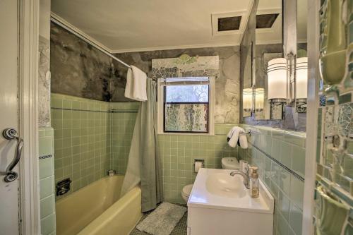 a bathroom with a sink and a toilet and a tub at Tulsa Rental Home - Walk to Philbrook Museum in Tulsa