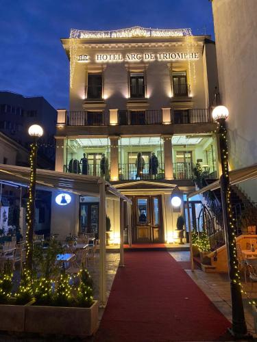 a building with a red carpet in front of it at Apartamente Arcul de Triumf in Bucharest