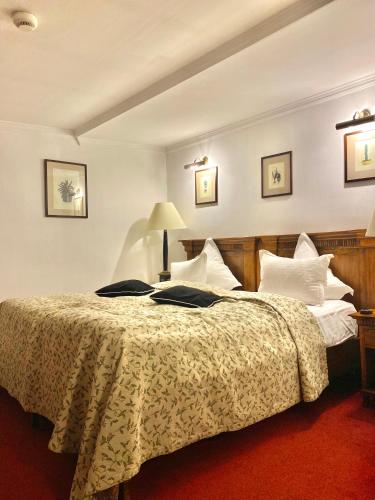 a bedroom with a large bed with white pillows at Apartamente Arcul de Triumf in Bucharest