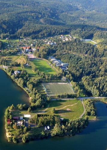an aerial view of an island in a lake at Hotel Břízky in Jablonec nad Nisou