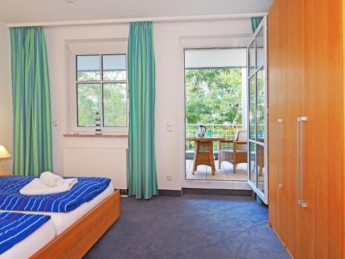 Postel nebo postele na pokoji v ubytování Kaiservillen Heringsdorf - Ferienwohnung mit 1 Schlafzimmer und Balkon C24