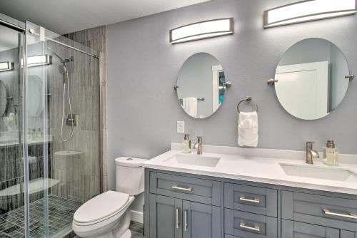 a bathroom with a shower and a toilet and a sink at Beach Break Home with Hot Tub - Walk to Beach in Westport