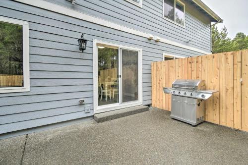 a barbecue grill on the side of a house at Beach Break Home with Hot Tub - Walk to Beach in Westport