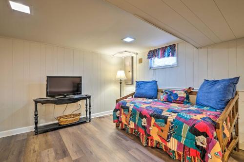 a bedroom with a bed and a flat screen tv at Pet-Friendly Home Less Than 6 Mi to National Mall! in Hillcrest Heights