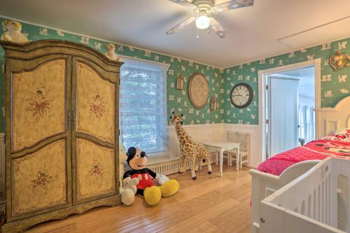 a bedroom with a stuffed animal and a giraffe at 1 Mi to Lake Wallenpaupack Spacious Poconos Villa in Hawley