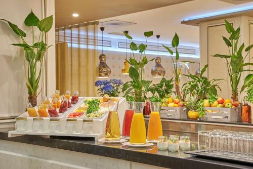 a buffet with many different types of drinks on display at NH Collection Madrid Abascal in Madrid
