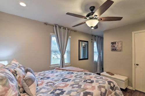 a bedroom with a ceiling fan and a bed at Lake Access and Pool Spacious Freeport Home! in Freeport