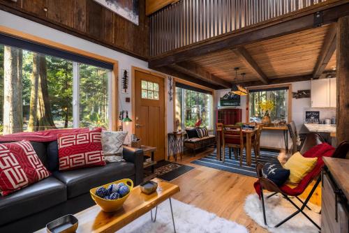 a living room with a couch and a table at On Mountain Time in Glacier