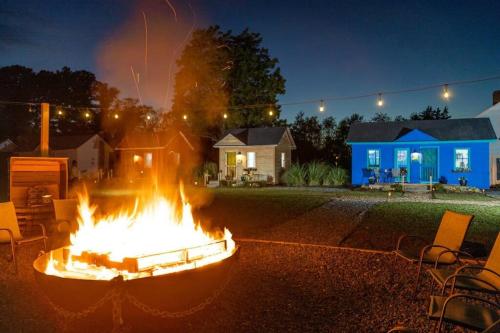 a large fire pit in a yard at night at Cape Charles Tiny Livin' in Cape Charles