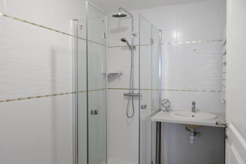 a bathroom with a shower and a sink at Holiday Home Morgat near Sandy Beach in Morgat