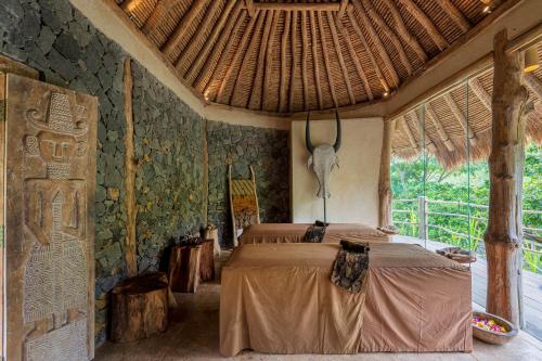 a bedroom with a bed in a room at MATHIS Lodge Amed in Amed