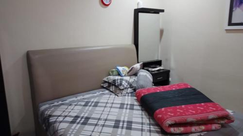 a small bed in a small room with a mattress at Second home in Jakarta