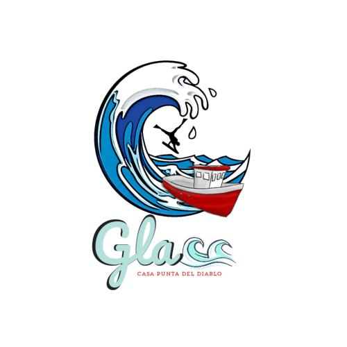 a wave and a boat in the ocean at Glass in Punta Del Diablo