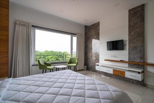 TV a/nebo společenská místnost v ubytování Hylife hotels and conventions