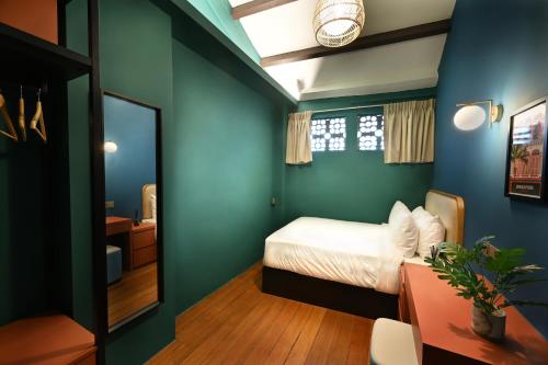 Ένα ή περισσότερα κρεβάτια σε δωμάτιο στο Dream Chaser Boutique Capsule Hotel