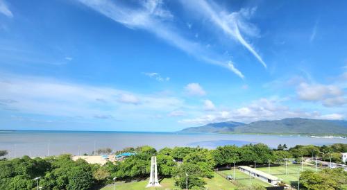 a view of the beach and the ocean at Cairns Luxury Seaview Apartment in Cairns