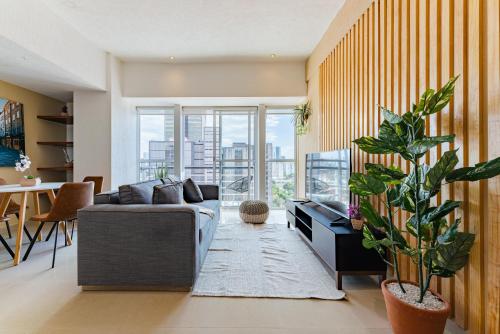 a living room with a couch and a table at Anahuac Apartments by VH in Mexico City