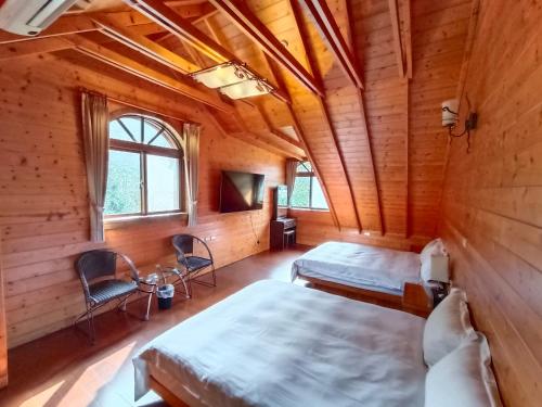 Postel nebo postele na pokoji v ubytování Rong Yuan Gu Homestay