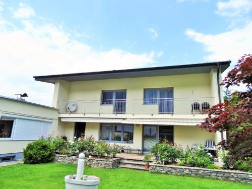 a house with a lawn in front of it at Apartment in Axams near Axamer Lizum in Innsbruck