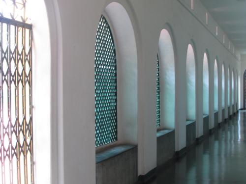 a hallway of a building with a row of windows at YWCA GALLWAY GUEST HOUSE in Kolkata