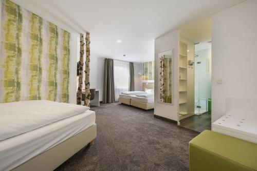 Postel nebo postele na pokoji v ubytování Hotel Günter