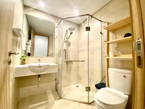 a bathroom with a shower and a toilet and a sink at 2915 Hạ Long in Ha Long