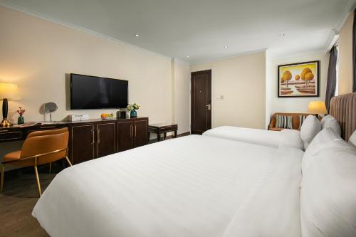 San Palace Hotel & Rooftopにあるベッド